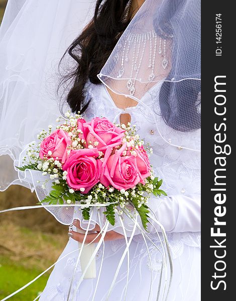 Beautiful bridal bouquet in the hands of the bride