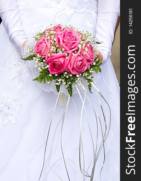 Beautiful bridal bouquet in the hands of the bride