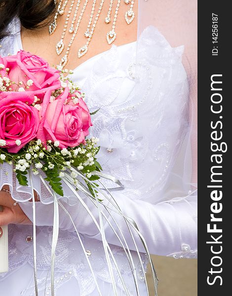 Beautiful bridal bouquet in the hands of the bride