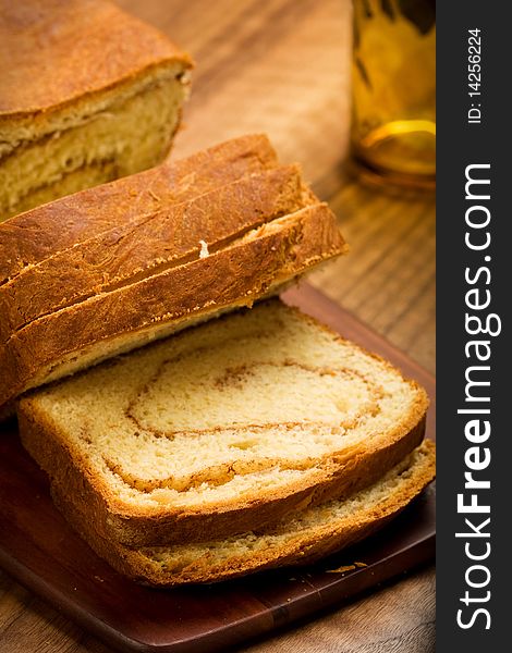 Freshly made cinnamon swirl bread on bread board