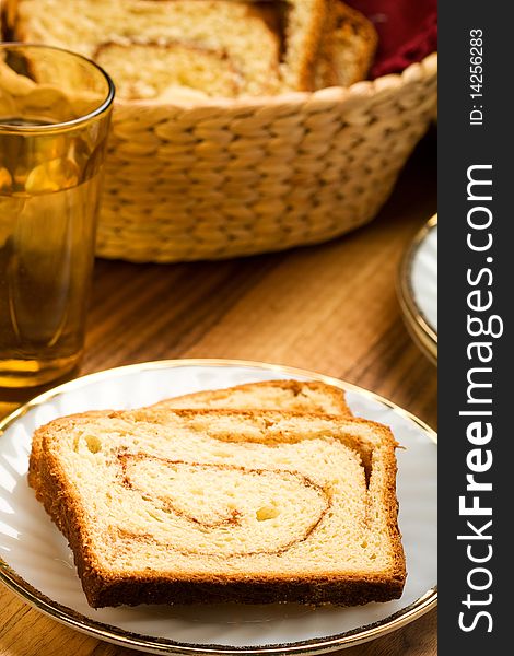 Freshly made cinnamon swirl bread on white plate