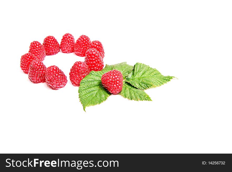 Fresh ripe raspberries and green leaves isolated on a white background. Fresh ripe raspberries and green leaves isolated on a white background.