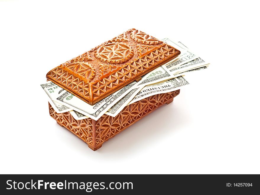 Dollars in wooden box isolated on white. With soft shadow. Dollars in wooden box isolated on white. With soft shadow