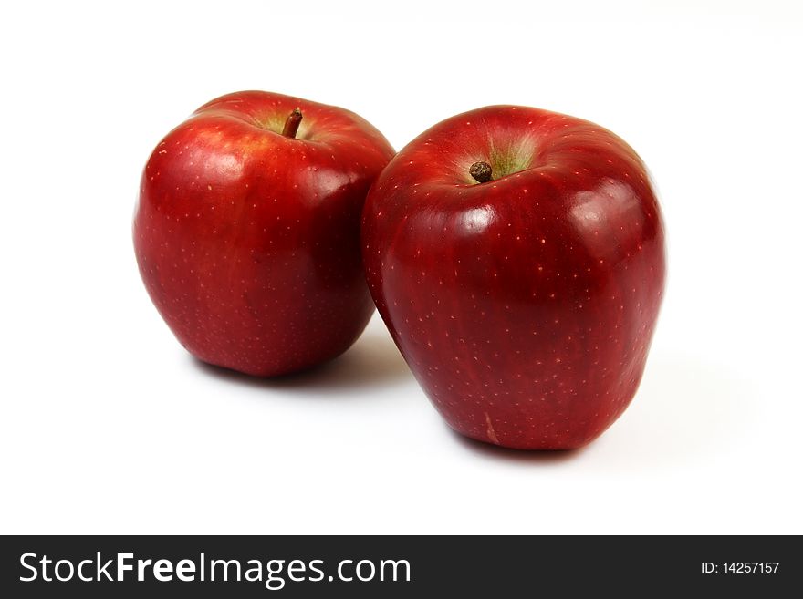 Shiny red apples isolated over white background.