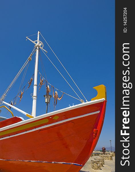 The nose of the famous red boat with octopus on the island of Mykonos. The nose of the famous red boat with octopus on the island of Mykonos...