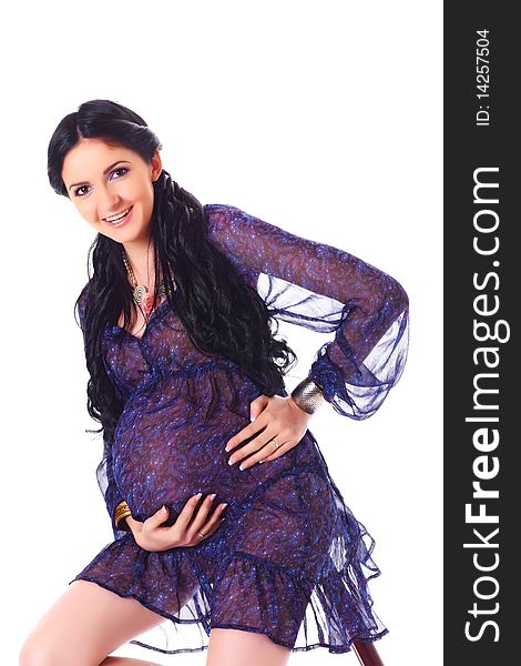 Beautiful elegant pregnant woman holding tummy proudly. Beautiful elegant pregnant woman holding tummy proudly