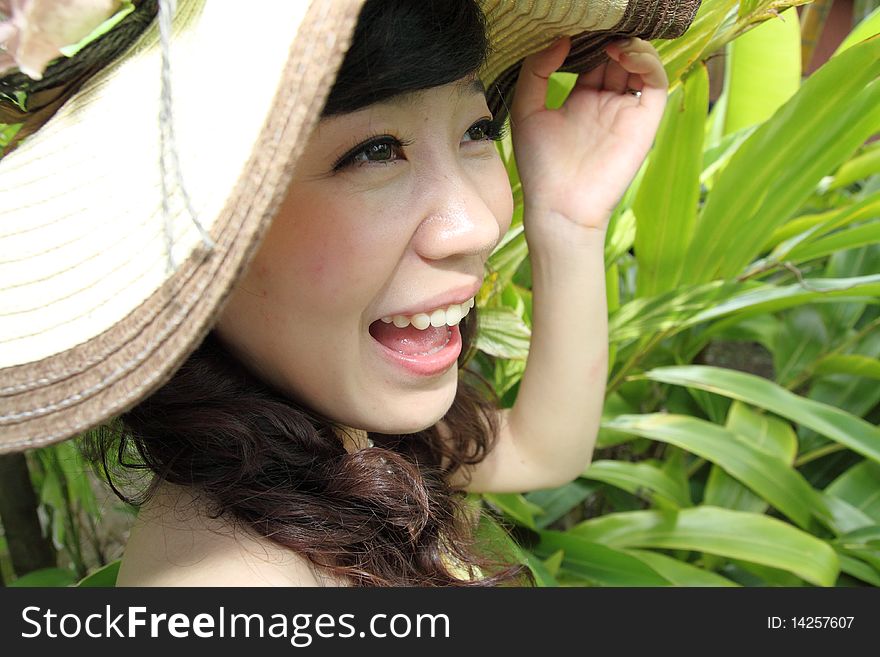 A happy asian girl with beautiful hat. A happy asian girl with beautiful hat