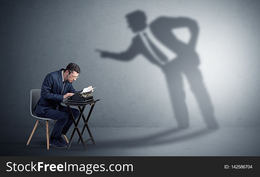 Man working hard and shadow arguing with him