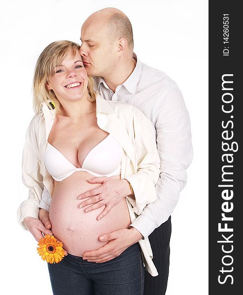 Pregnant woman poses with her husband. Not a young pair. Pregnant woman poses with her husband. Not a young pair