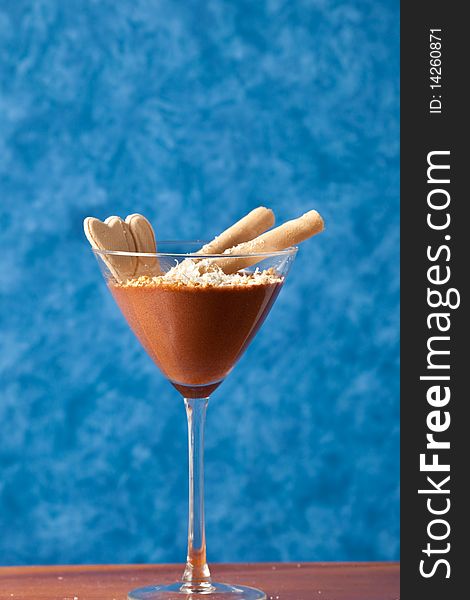 Photo of sweet brown choccolate cream in a glass