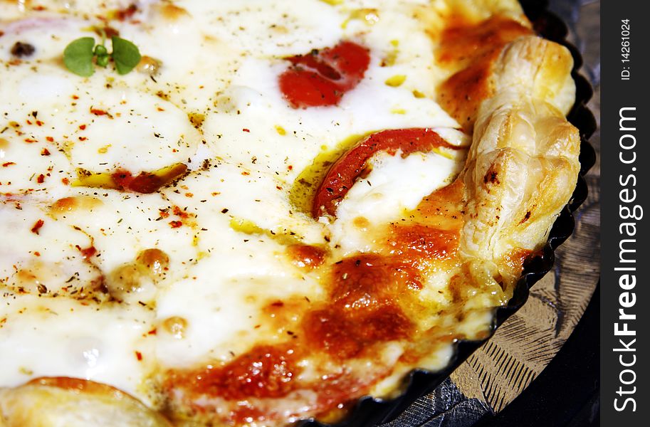 Baked italian pizza with tomato and mozzarella