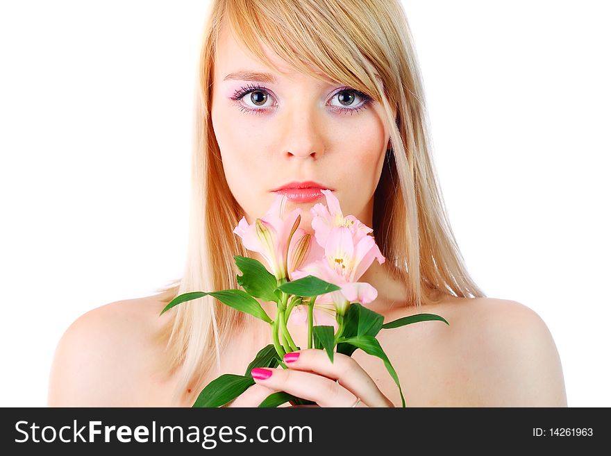 Portrait of a woman holding pink flowers over white background