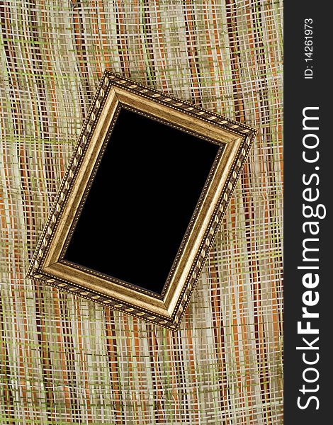 Vintage frame on wicker background