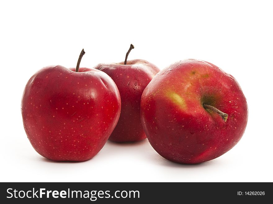 Three red apples isolated on white