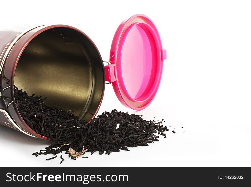 Scattered tea in a tin isolated on white