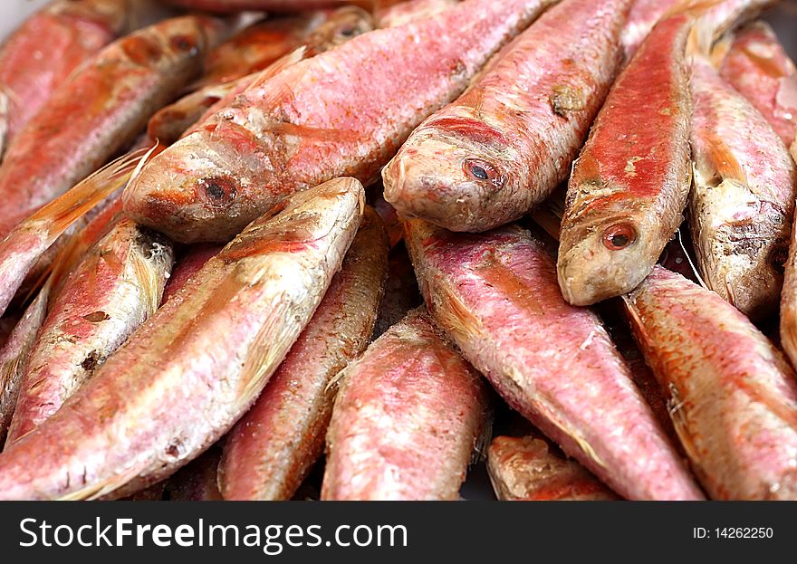 Assortment of fresh fish for sale at an outdoor country market. Assortment of fresh fish for sale at an outdoor country market.