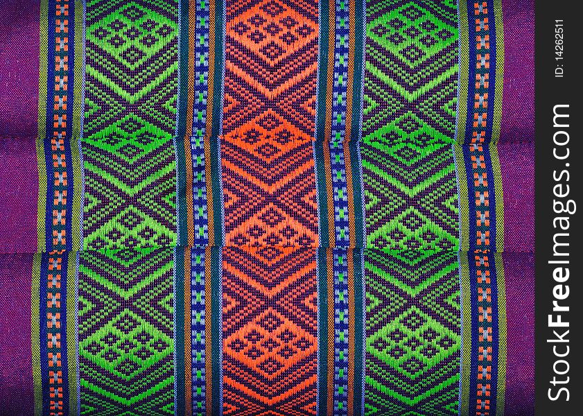 Native embroidery on pillow of thailand .