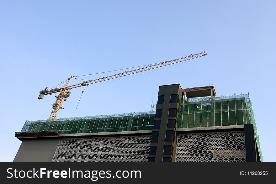 Building under construction with crane