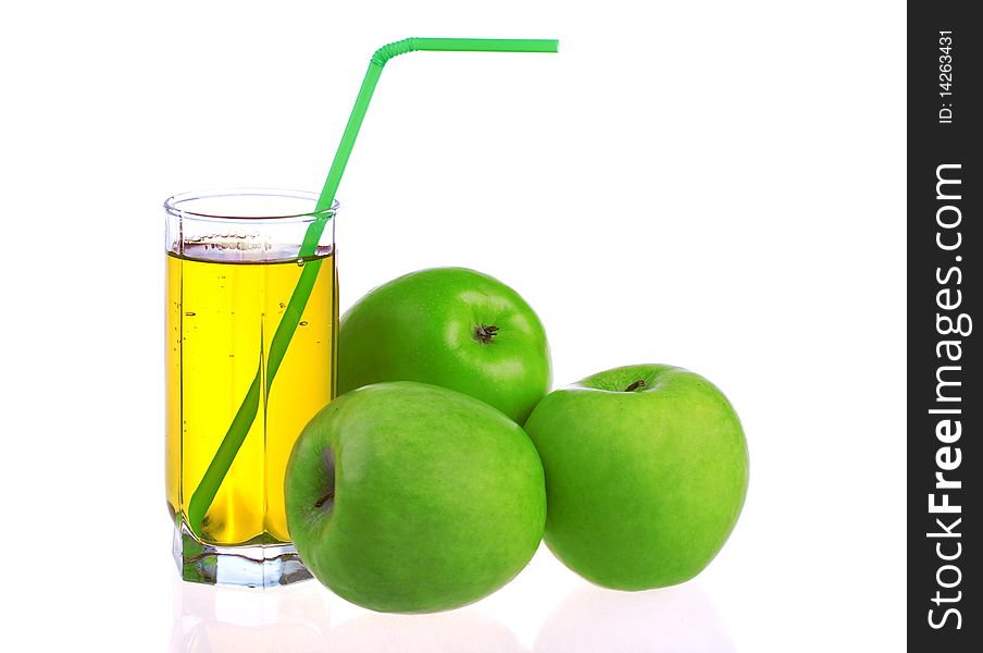 Glass of apple juice with green apples isolated on white background