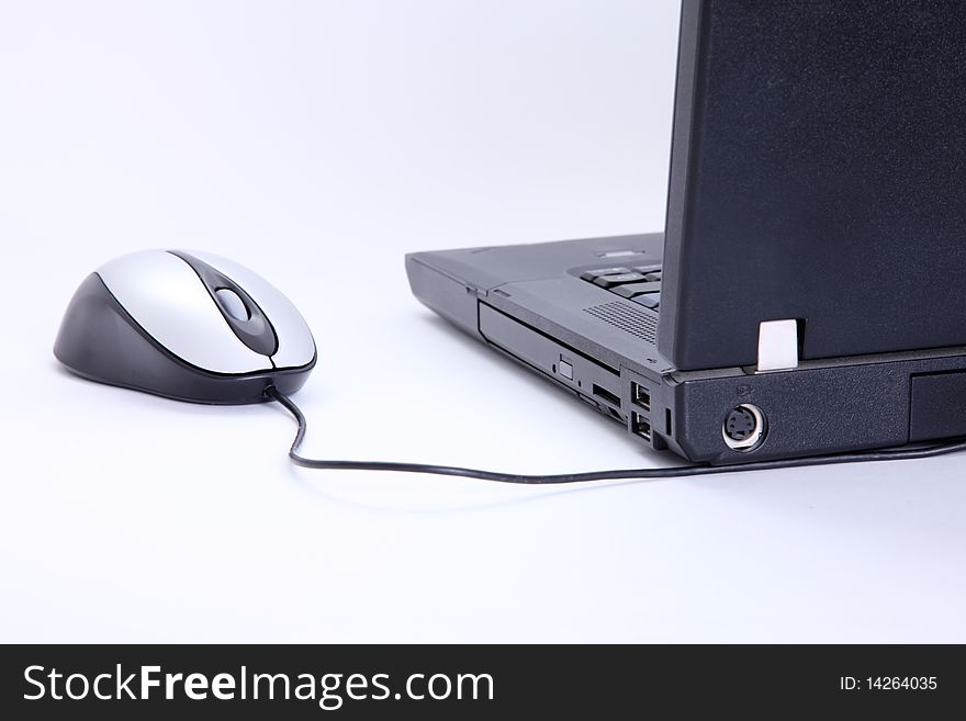 Laptop with mouse over white background. Technology image. Laptop with mouse over white background. Technology image