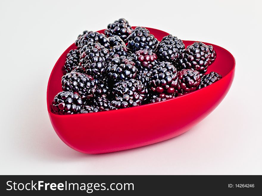 Heart shaped bowl of fresh blackberries. Heart shaped bowl of fresh blackberries.