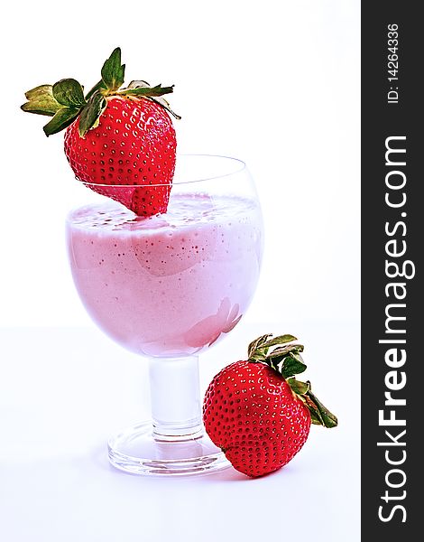 Strawberry smoothie with fresh plump strawberries to garnish. Strawberry smoothie with fresh plump strawberries to garnish.