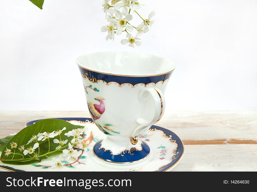 Beautiful teacup with white spring flowers