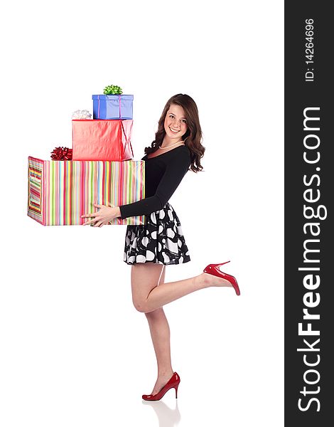 Happy woman carrying lots of presents. Happy woman carrying lots of presents