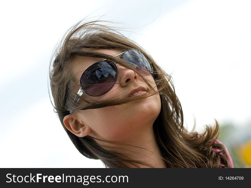 Portrait of a beautiful teenage girl in sunglasses. Portrait of a beautiful teenage girl in sunglasses