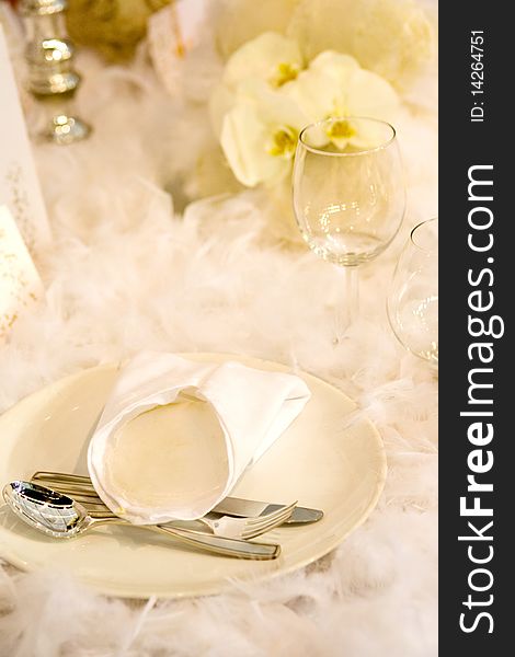 Elegant dinner table with yellow flowers