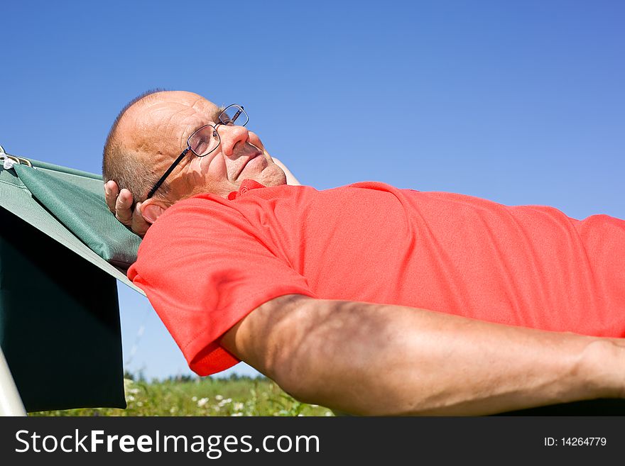 Happy Man Lying On Hammock