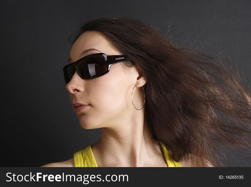 A Portrait Of A Woman In Sun Glasses