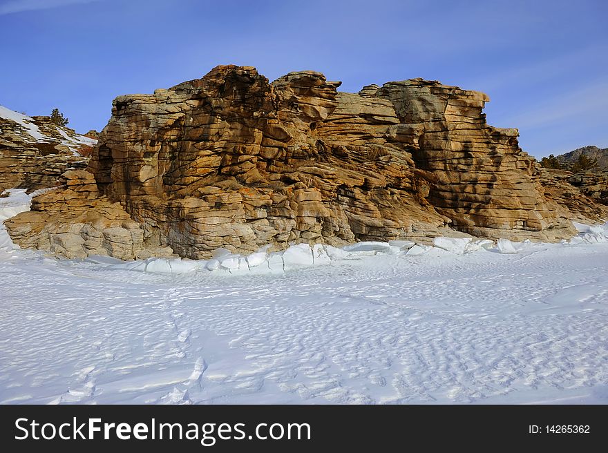 Winter in mountains, a winter sunny day with the blue sky.