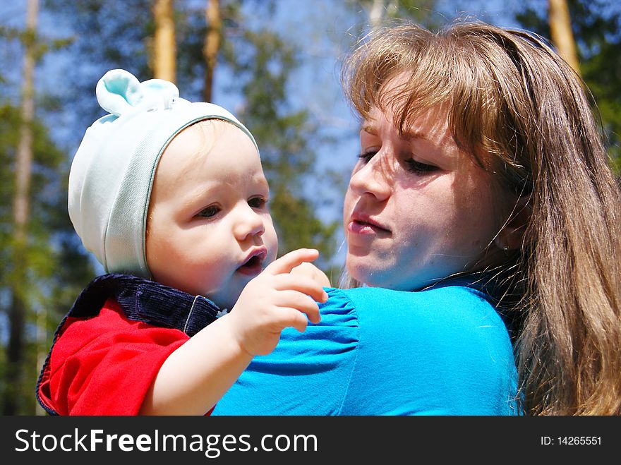 Mum holds the son on hands