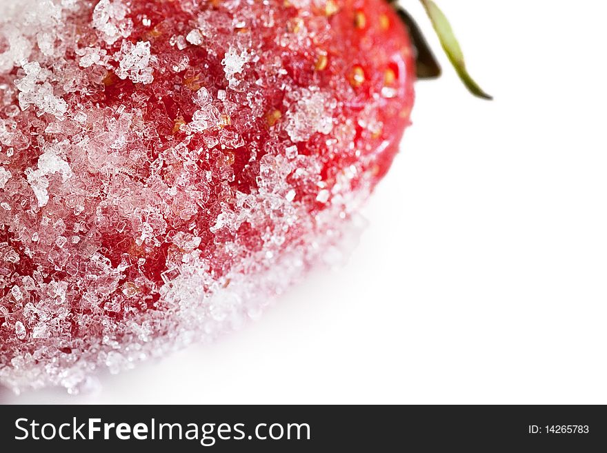 Macro shot of a strawberry dredged with sugar isolated on white