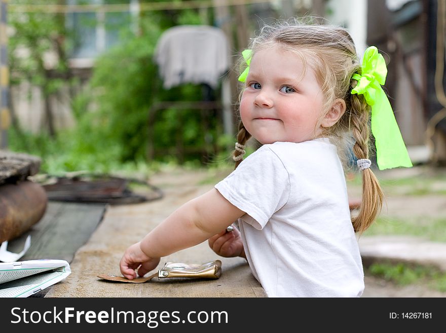 Little girl playing in the garden