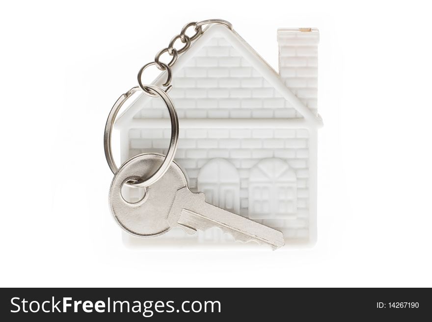 Keychain in the form of home and the key on a white background