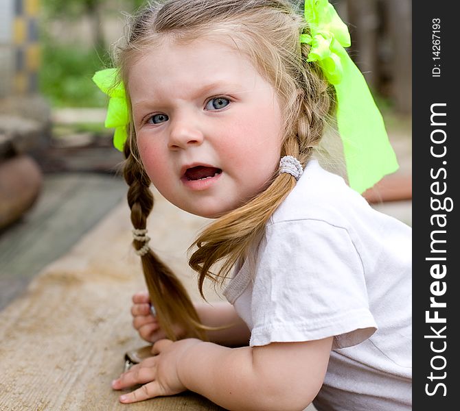 Little girl playing in the garden