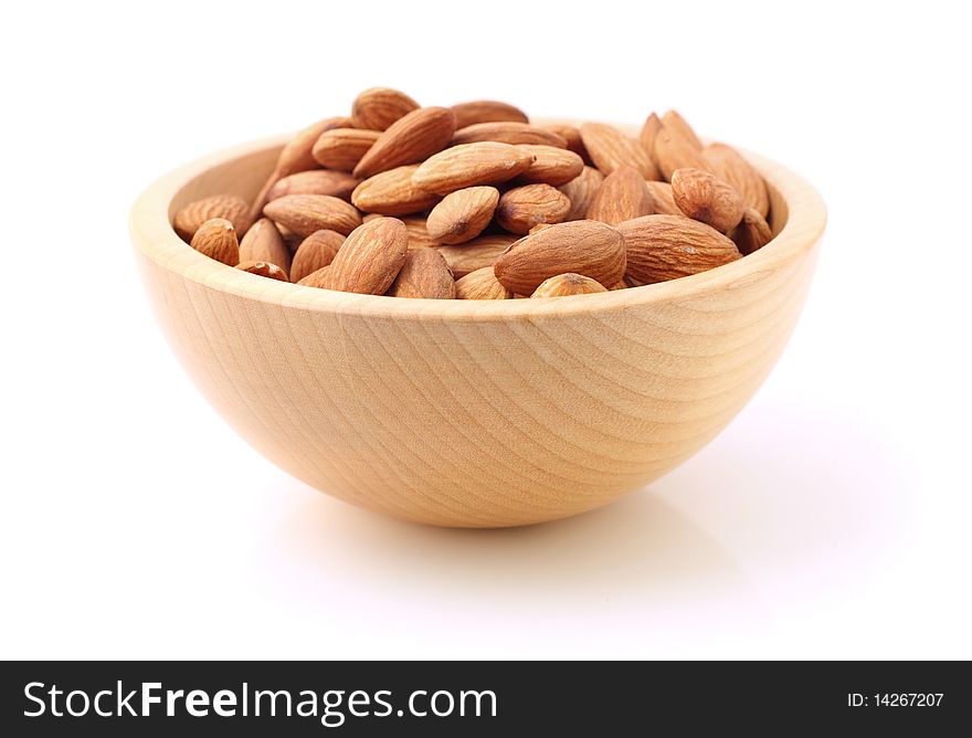Bowl of almonds on white background