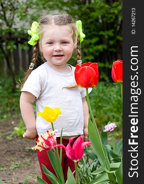 Little girl playing in the garden