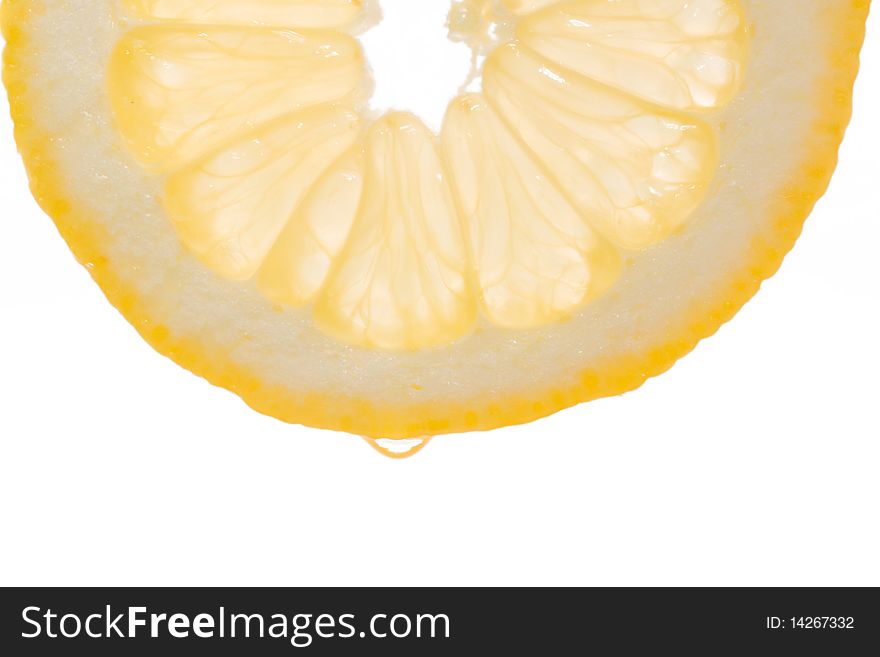 Lemon slice with a drop of water on a white background