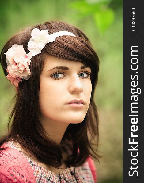 Young pretty girl with dark hair outdoor portrait. Young pretty girl with dark hair outdoor portrait