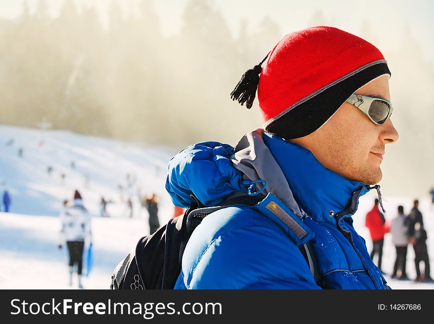 Young man in a red hat and sunglasses