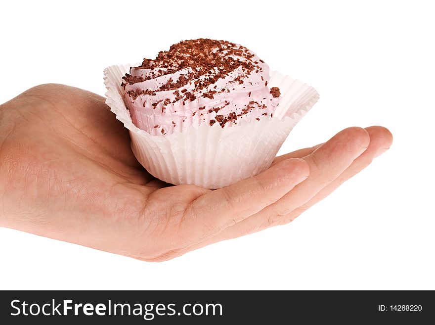 Dessert in human hand isolated on white background