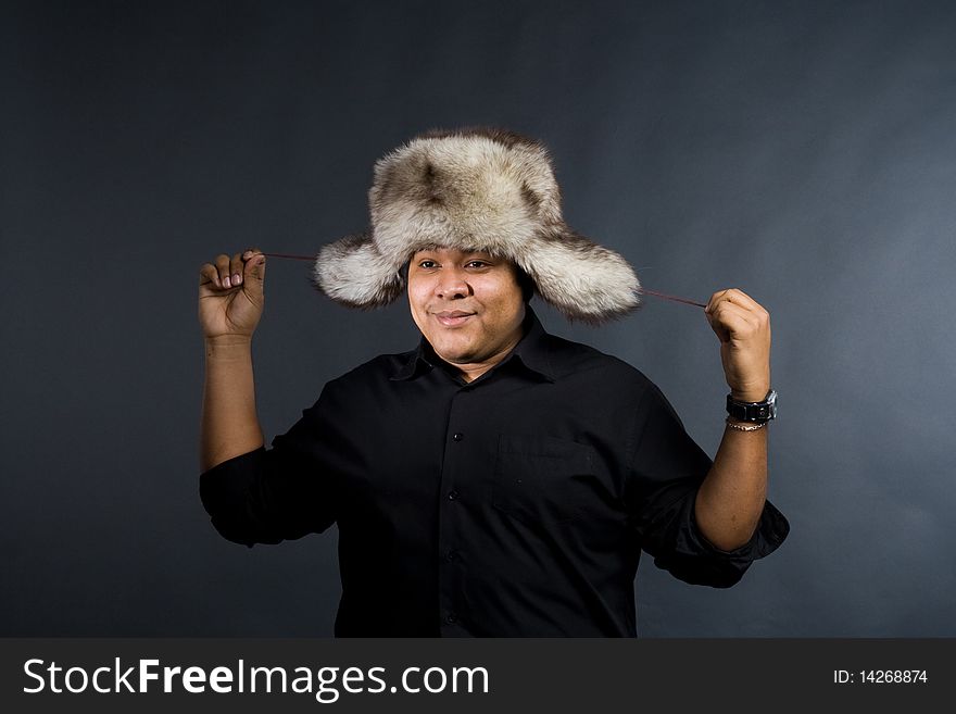 Young man with grey fur hat. Young man with grey fur hat