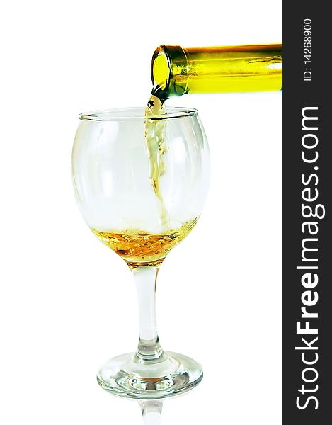 White wine pouring down from a wine bottle against white background