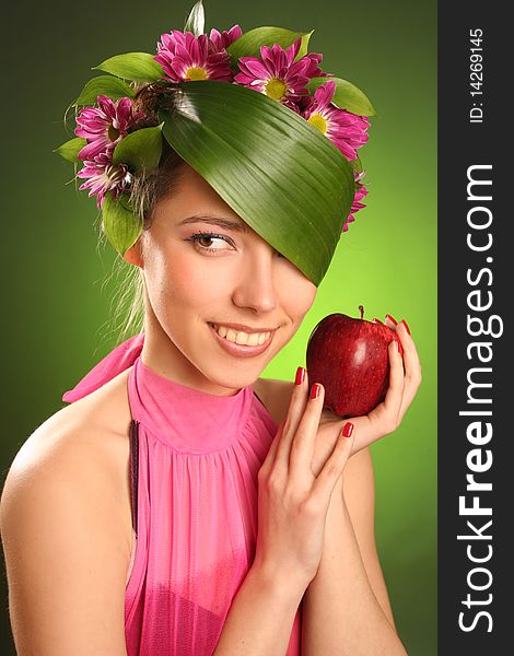 Beautiful spring-woman with red apple. Beautiful spring-woman with red apple