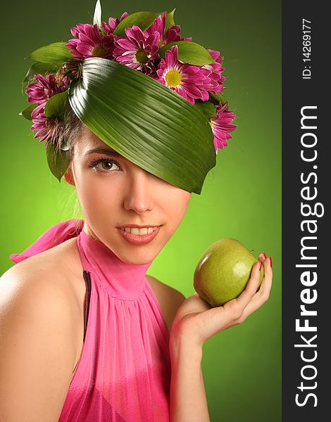 Beautiful spring-woman with green apple. Beautiful spring-woman with green apple