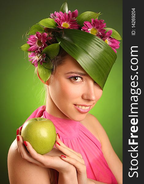 Beautiful spring-woman with green apple