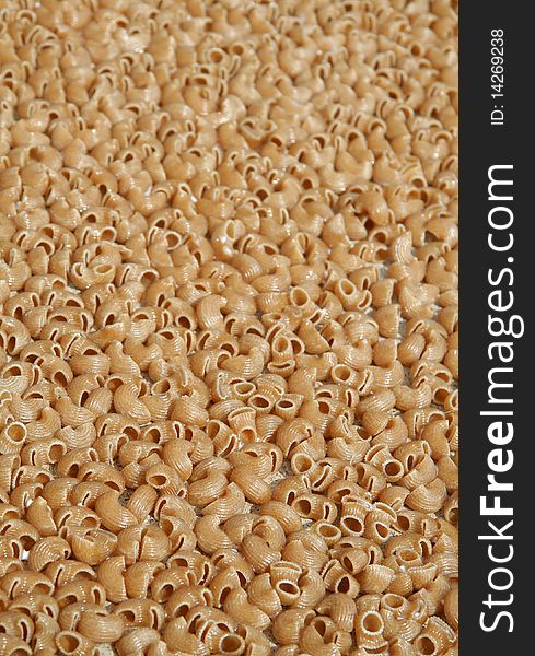 Brown macaroni vertical photo background. Brown macaroni vertical photo background